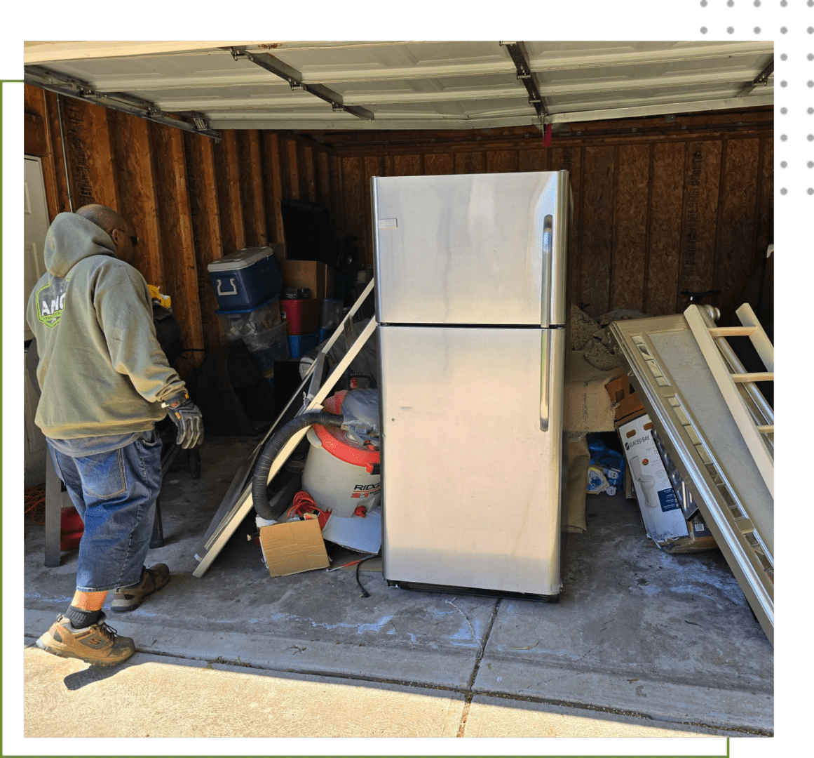 A man standing in front of an open garage door.