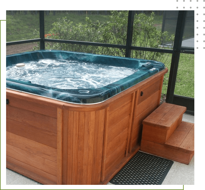 A hot tub with steps leading to the bottom.