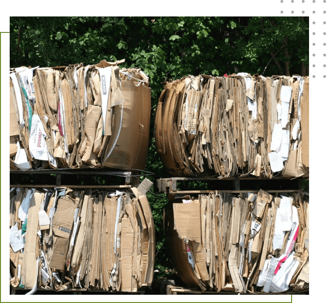 A stack of cardboard boxes with papers on them.