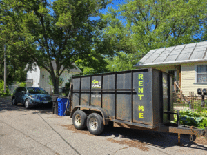 AMG dumpster trailer parked in a suburban Cleveland driveway