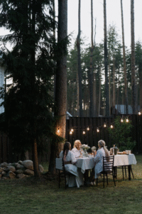 A clean backyard with chairs set up for a summer gathering
