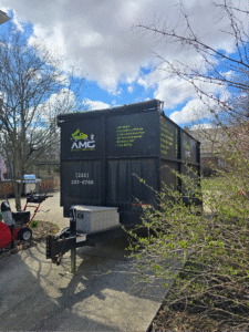 A junk truck parked outdoors.