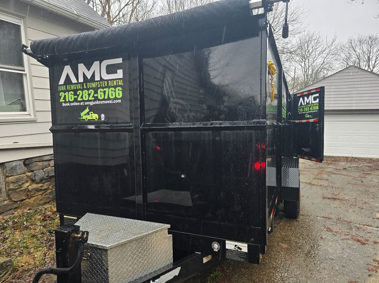 Driveway-safe dumpster placed outside a Brooklyn, OH home.