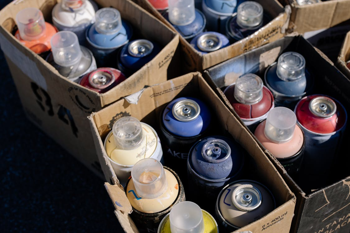 Spray paints in boxes.