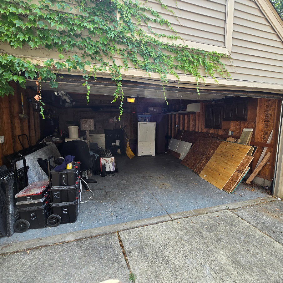 A junk removal in the garage by AMG Junk Removal.