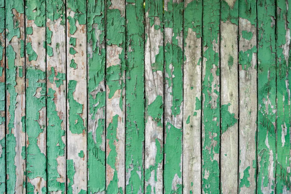 A weathered wooden fence in a Warrensville Heights home, showing the need for professional fence removal.