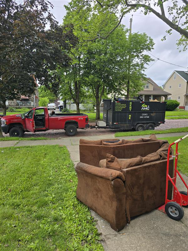 Large roll-off dumpster rental placed in a Lakewood driveway during a home renovation project.
