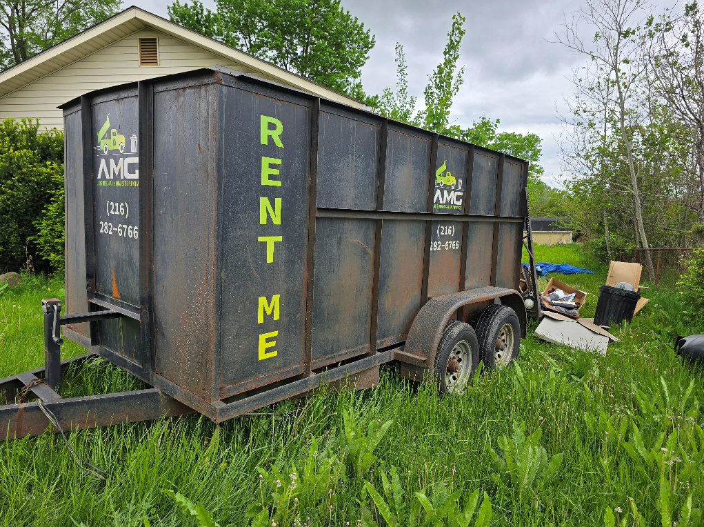 AMG dumpster rental in Cleveland prepared for hoarder house cleanout.