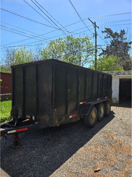 AMG Junk Removal yard waste dumpster in Cleveland for residential cleanup.