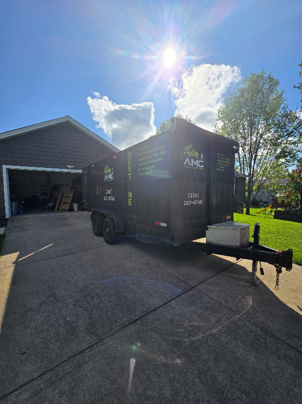 AMG Junk Removal & Dumpster Rental driveway dumpster rental in Cleveland for pre-sale home cleanout.