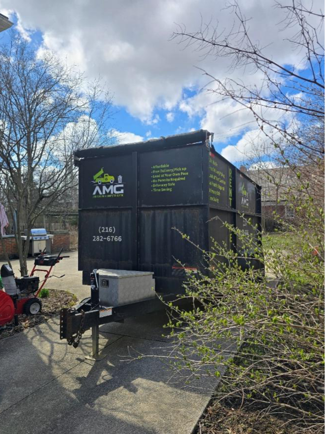 AMG Junk Removal dumpster rental in Cleveland for yard waste cleanup.